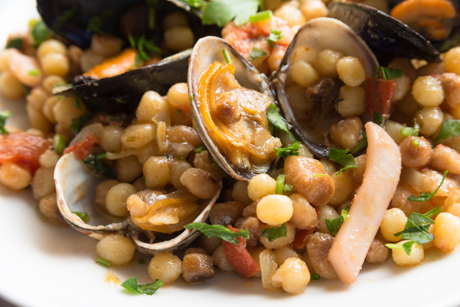 fregula-con-frutti-di-mare-traditional-sardinian-durum-wheat-pasta-with-seafood