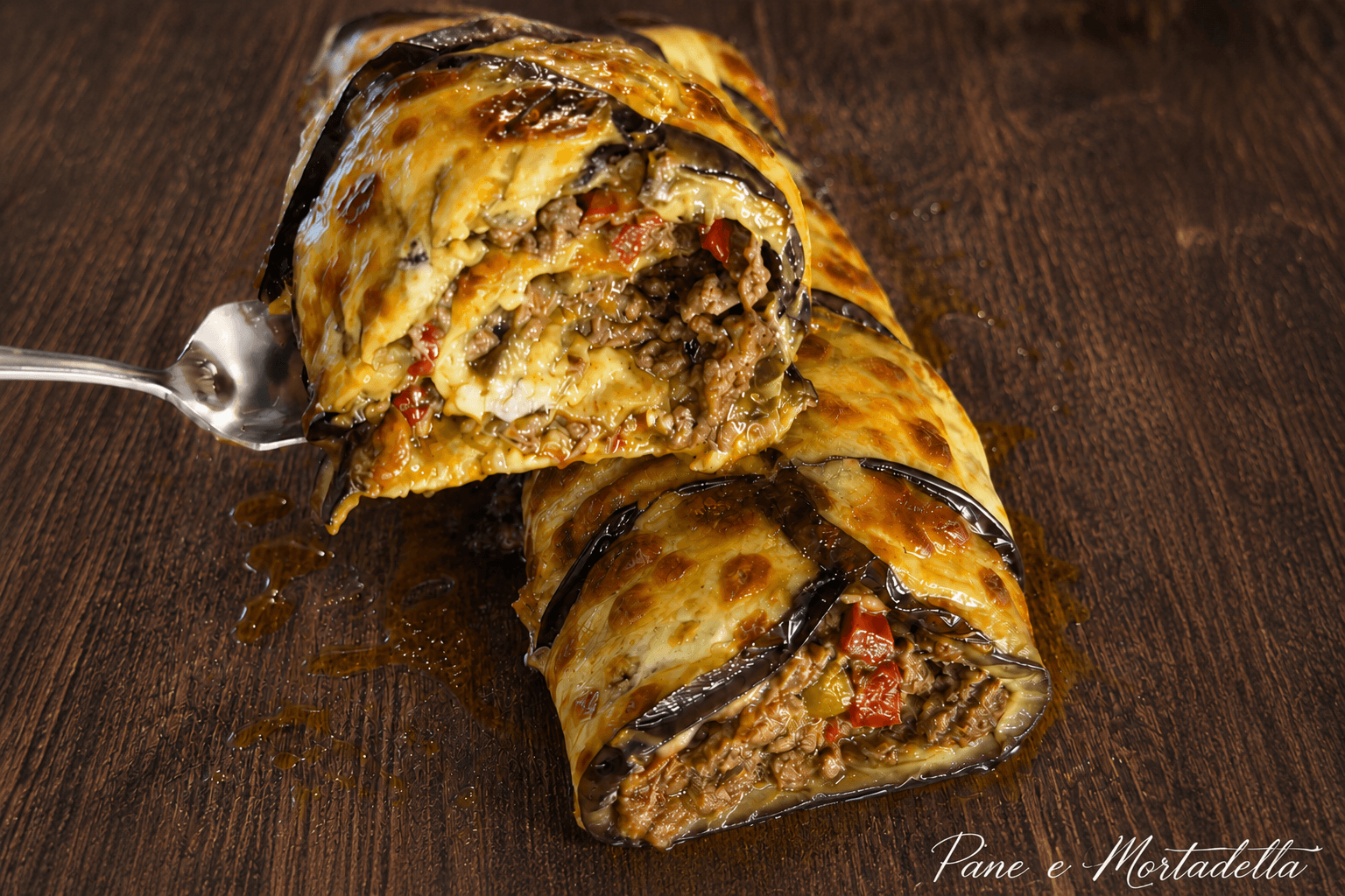 Rotolo di melanzane: dal ripieno filante e sorprendente, facilissimo da preparare